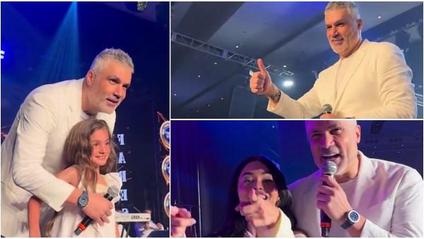 فارس كرم على المسرح في حفله بالمكسيك مع طفلة ومعجبة خلال لحظة تفاعل إنساني