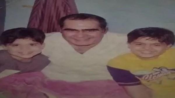 سيد زيان مع حفيده في صورة قديمة تعكس علاقة عائلية دافئة